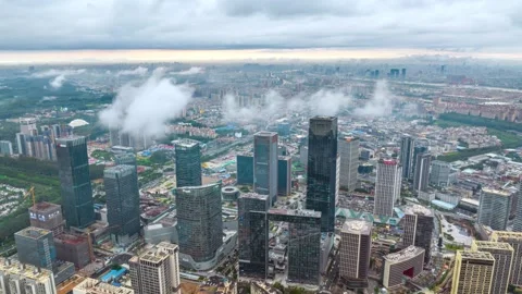 Wanbo dark tower emerging through low clouds in Guangzhou China Video stock 345956642