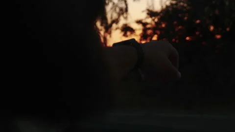 WANDERLUST CONCEPT Close-up driver man enjoying beautiful summer sunset car ride Stock Footage 172045086