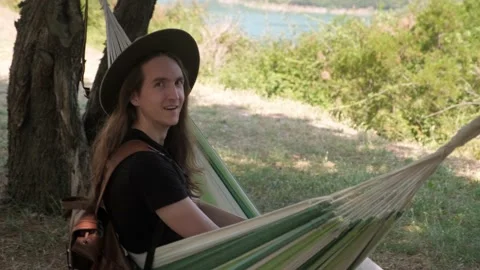 Wanderlust man on hammock. Stock Footage 202073895