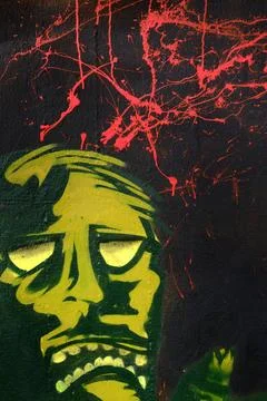 Wandmalerei, Graffito Graffito mit verspritzter roter Farbe und einem Maen... Stock Photos