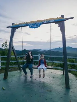 Wang Kelian view point swing with children tourists. Stock Photos
