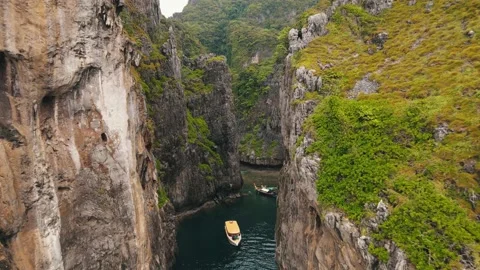 Wang Long Bay hidden behind the enormously steep rock walls which are Stock Footage 169647347