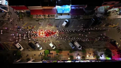 The Wangkang procession lights the streets in a night drone shot. Видео 318271076