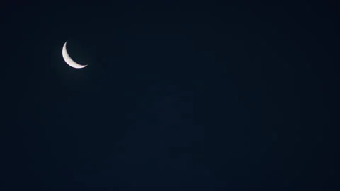 Waning Crescent moon phase in the night time sky Video stock 153239397