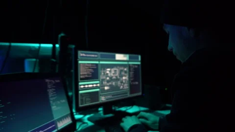 Wanted hackers coding virus ransomware using laptops and computers in the Stock Footage 99579307
