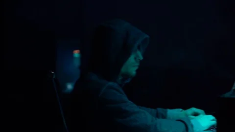 Wanted hackers coding virus ransomware using laptops and computers in the Stock Footage 99580130