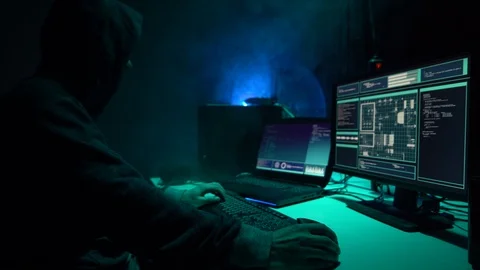 Wanted hackers coding virus ransomware using laptops and computers in the Stock Footage 101510569