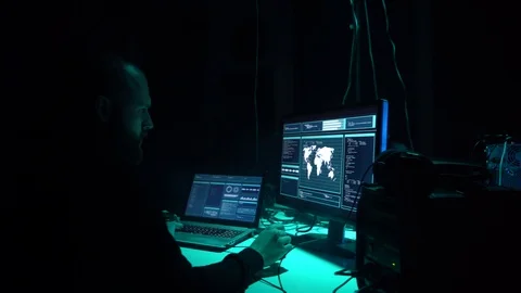 Wanted hackers coding virus ransomware using laptops and computers in the Stock Footage 101511477