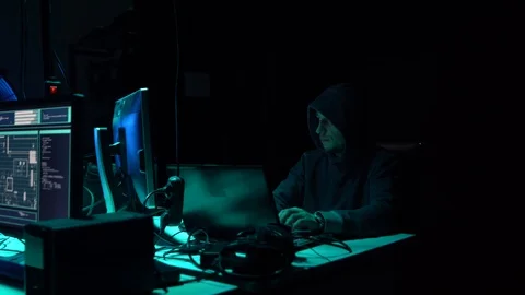Wanted hackers coding virus ransomware using laptops and computers in the Stock Footage 101511912