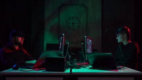 Wanted hackers coding virus ransomware using laptops and computers. Cyber attack Stockbeeldmateriaal 114261982