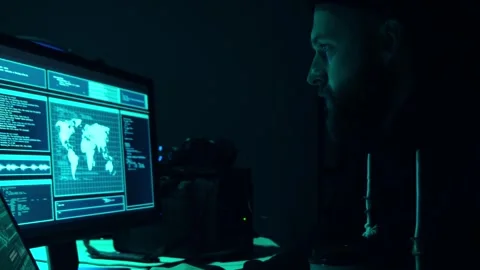 Wanted hackers coding virus ransomware using laptops and computers in the Stock Footage 304580720