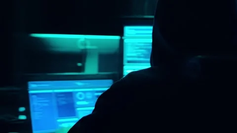 Wanted hackers coding virus ransomware using laptops and computers in the Stock Footage 304581386
