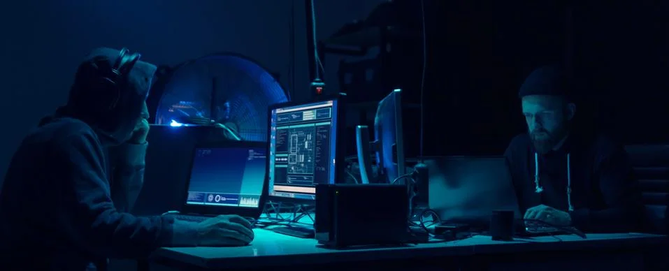 Wanted hackers coding virus ransomware using laptops and computers. Cyber attack 스톡 사진