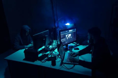 Wanted hackers coding virus ransomware using laptops and computers. Cyber attack 库存照片