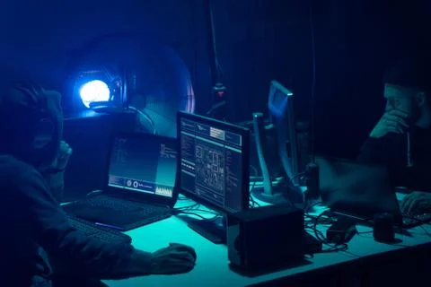 Wanted hackers coding virus ransomware using laptops and computers. Cyber attack 库存照片