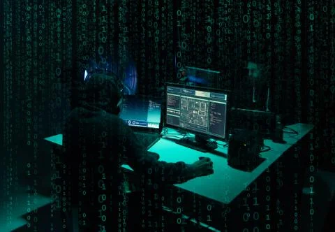 Wanted hackers coding virus ransomware using laptops and computers. Cyber attack 库存照片