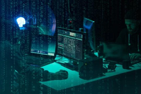 Wanted hackers coding virus ransomware using laptops and computers. Cyber attack 写真素材
