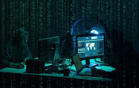 Wanted hackers coding virus ransomware using laptops and computers. Cyber attack 库存照片