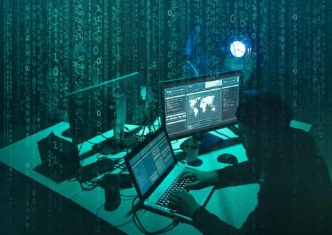Wanted hackers coding virus ransomware using laptops and computers. Cyber attack Stock Photos