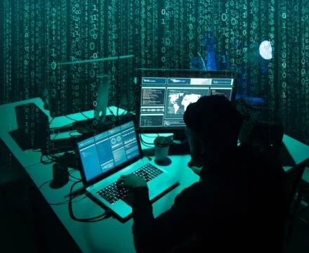 Wanted hackers coding virus ransomware using laptops and computers. Cyber attack 库存照片