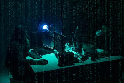 Wanted hackers coding virus ransomware using laptops and computers. Cyber attack Foto stock