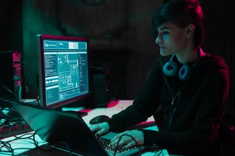 Wanted hackers coding virus ransomware using laptops and computers in the 写真素材