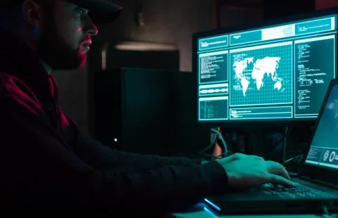 Wanted hackers coding virus ransomware using laptops and computers in the 库存照片