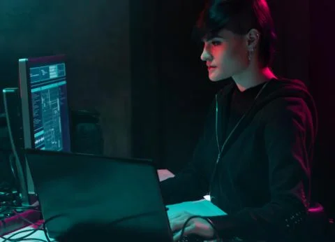 Wanted hackers coding virus ransomware using laptops and computers in the 写真素材