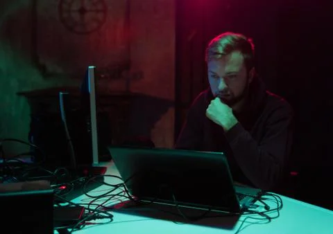 Wanted hackers coding virus ransomware using laptops and computers in the 写真素材