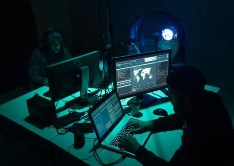 Wanted hackers coding virus ransomware using laptops and computers. Cyber attack 库存照片
