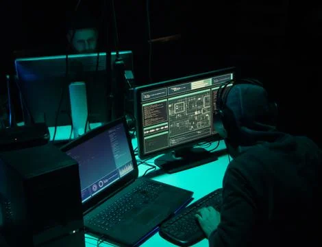 Wanted hackers coding virus ransomware using laptops and computers. Cyber attack 写真素材