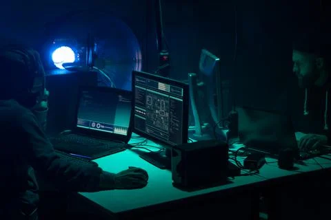 Wanted hackers coding virus ransomware using laptops and computers. Cyber attack 库存照片