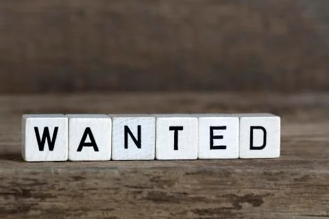 Wanted, written in cubes Stock Photos
