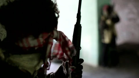 War. Abandoned building. Armed men are hiding. Stock Footage 68659182