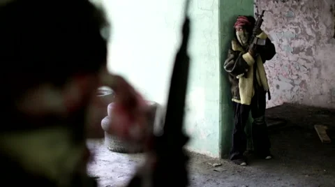 War. Abandoned building. Armed men are hiding. Stock Footage 68659208