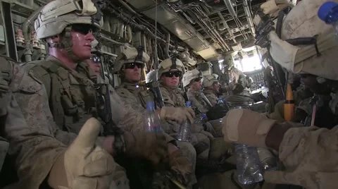 War in Afghanistan - Exhausted U.S. Marines on helicopter after mission Stock Footage
