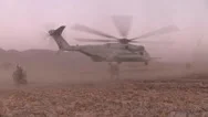 War In Afghanistan - Marine Helicopter Taking Off Kicks Up Dust In Desert Stock Footage