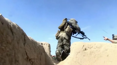 War in Afghanistan - U.S. Marines in fire fight with Taliban Stock Footage