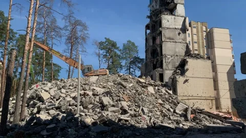 War Aftermath: Destroyed Building and Rubble with Excavator 動画素材 312017649