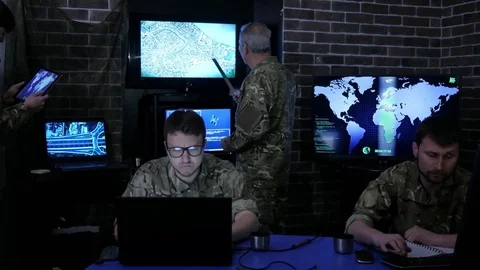 War base, group military IT professionals, on briefing, in Stock Footage