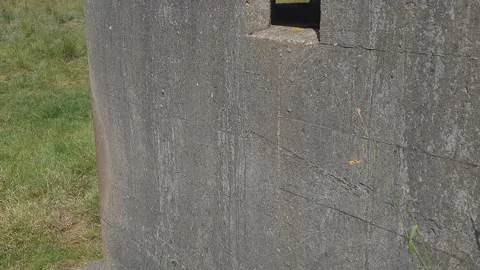 War Bunker with a window looking towards the coast Stockbeeldmateriaal 201528457