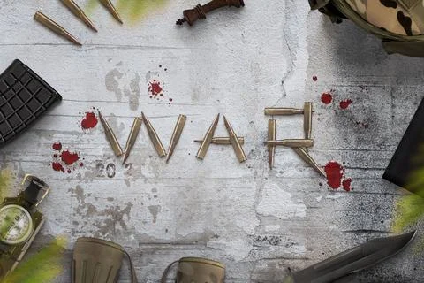 War composition on rough surface writen with bullets and surrounded with bloo Stock Photos