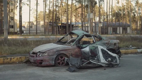 War-destroyed car in Irpin, Bucha district, Ukraine Video stock 253224221