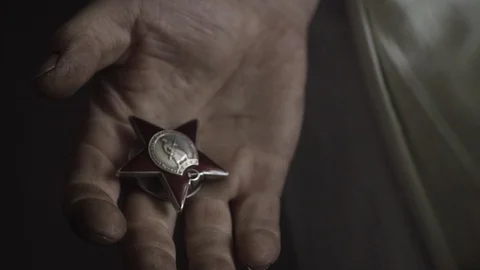 War Medal on hands Video stock 129757615