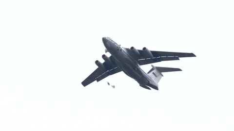 War plane. Skydivers jump out of the plane. Parachute deployment. Stock Footage 119629256