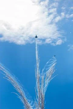 War planes in blue sky with clouds at the victory parade in the capital of Stock Photos