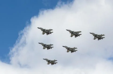 War planes in blue sky with clouds at the victory parade in the capital of Stock Photos