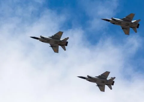 War planes in blue sky with clouds at the victory parade in the capital of Stock Photos