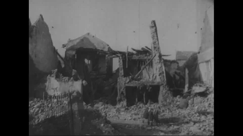 War refugees carry water through destroyed buildings - 1946 Stock Footage 99783538