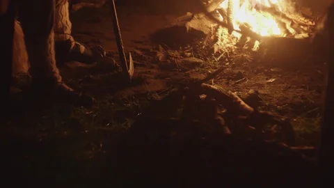 War time stand warriors ready for battle stand on fire night in camp in the Stock Footage 123758522